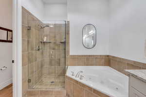 Primary bathroom with separate walk-in shower and tub