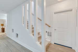 Staircase with hardwood / wood-style flooring