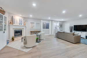 Family room featuring a fireplace and light hardwood / wood-style floors