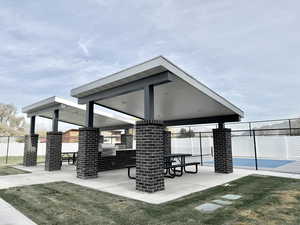 View of property's community featuring a gazebo and a lawn