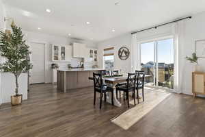 Dining room featuring dark wood-type flooring