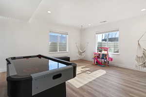 Recreation room featuring light wood-type flooring