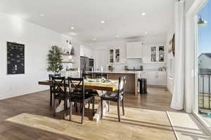 Dining space featuring light hardwood / wood-style flooring