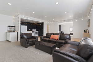 Living room featuring light colored carpet