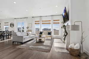 Living room with hardwood / wood-style flooring