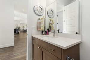 Bathroom with vanity and wood-type flooring