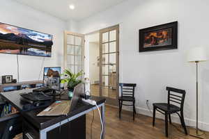 Office area with french doors and wood-type flooring