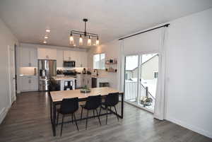 Dining area featuring a notable chandelier, and sliding glass door to back yard