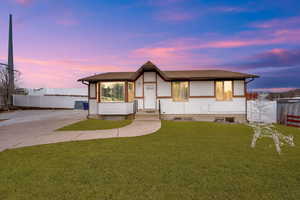 View of front of house with a lawn