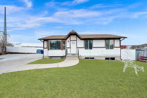 View of front of house with a front yard