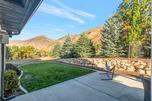 View of patio / terrace featuring a mountain view