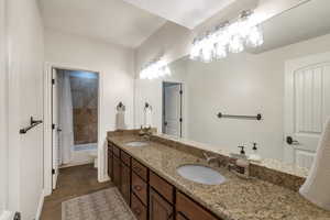 Full bathroom featuring vanity, shower / tub combo, and toilet