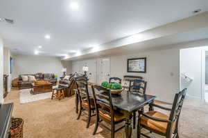 Dining room featuring light carpet