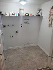 Laundry room featuring hookup for a washing machine, hookup for a gas dryer, hookup for an electric dryer, and a textured ceiling