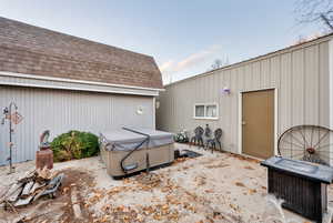 View of patio featuring a hot tub