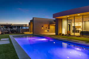 View of pool at dusk