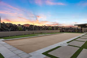 View of property's community with a bocce ball area