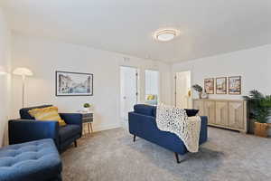 Living room with carpet floors