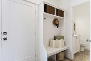 Mudroom with light hardwood / wood-style flooring