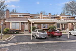 View of front facade featuring a carport