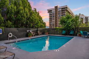 View of pool at dusk