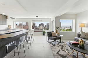 Tiled living room with a healthy amount of sunlight