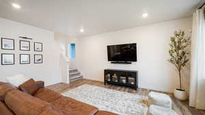 Living room with light hardwood / wood-style flooring