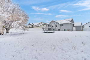 Snow covered house with a trampoline