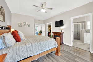 Bedroom featuring ensuite bath and a large walk in closet.