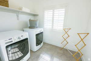 Laundry room featuring washing machine and dryer