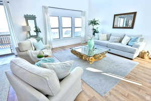 Living room with wood-type flooring