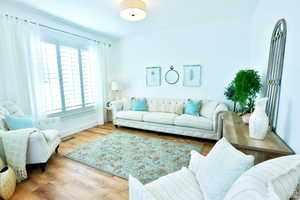 Living room with hardwood / wood-style floors