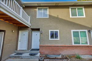 Property entrance featuring a balcony