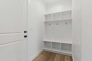 Mudroom with wood-type flooring