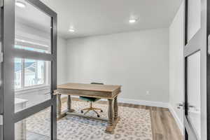 Office area featuring hardwood / wood-style flooring