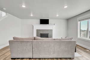 Living room with wood-type flooring