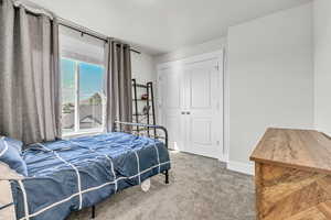 Bedroom with carpet and a closet