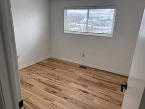 Spare room featuring light hardwood / wood-style flooring