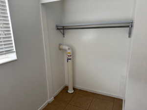 Laundry room with tile patterned flooring