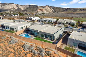 Birds eye view of property with a mountain view