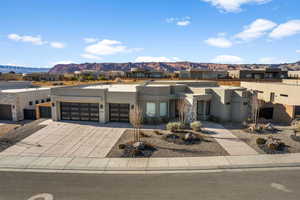 View of front facade with a mountain view and a garage