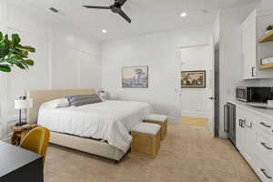 Bedroom featuring ceiling fan and light colored carpet