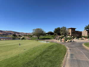 View of home's community with a yard and a water and mountain view