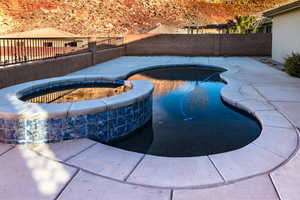 View of pool featuring an in ground hot tub