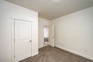 Unfurnished bedroom with carpet