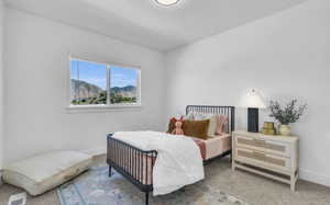 Carpeted bedroom featuring a mountain view