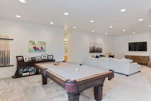 Rec room featuring light colored carpet and billiards