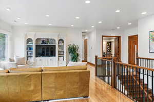 Living room with light hardwood / wood-style flooring