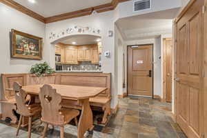 Dining area with ornamental molding