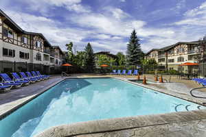 View of swimming pool with a patio area
